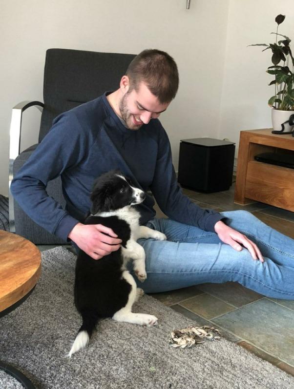 Duncan Teege with Skye, a border collie puppy